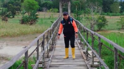 Pj Kades Tungka Ajak Masyarakat Swadaya Jembatan Tapuan